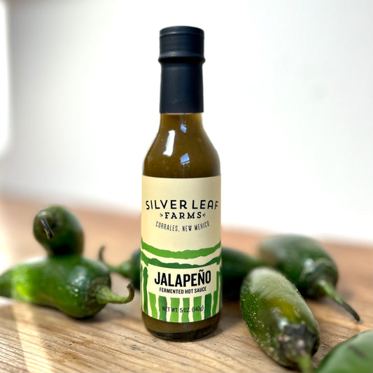 Silver Leaf Farms Jalapeño Fermented Hot Sauce bottle with jalapeño peppers